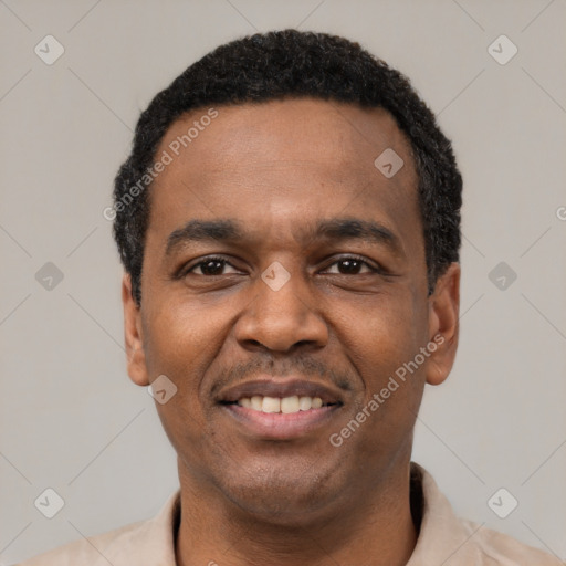 Joyful latino adult male with short  black hair and brown eyes