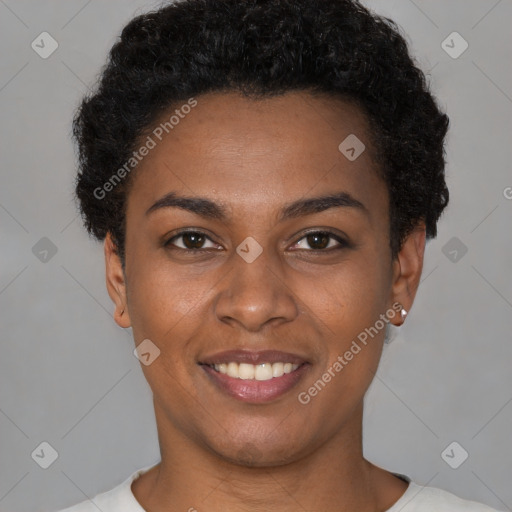 Joyful black young-adult female with short  brown hair and brown eyes