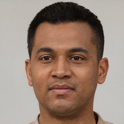 Neutral latino young-adult male with short  black hair and brown eyes