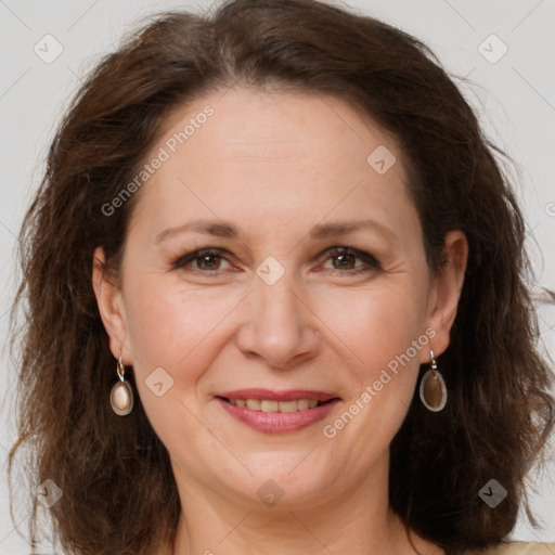 Joyful white adult female with long  brown hair and brown eyes