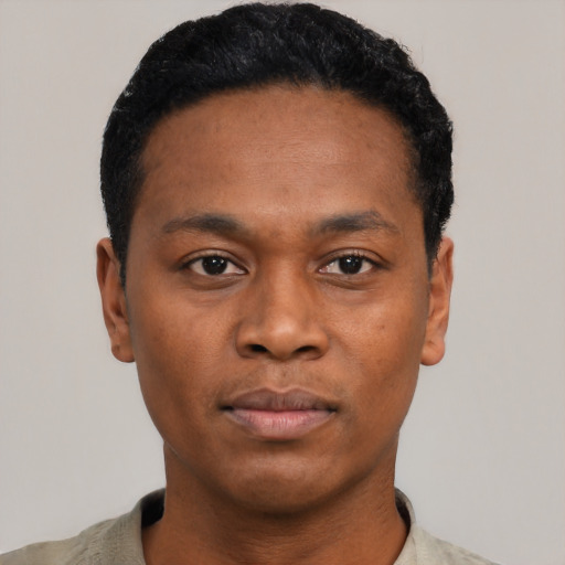 Neutral black young-adult male with short  black hair and brown eyes