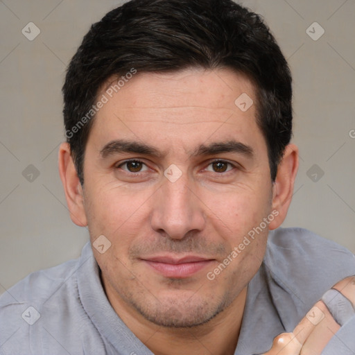 Joyful white adult male with short  brown hair and brown eyes