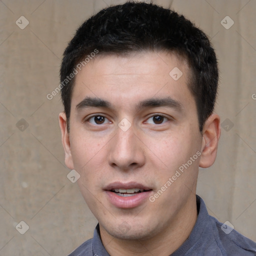 Joyful white young-adult male with short  black hair and brown eyes