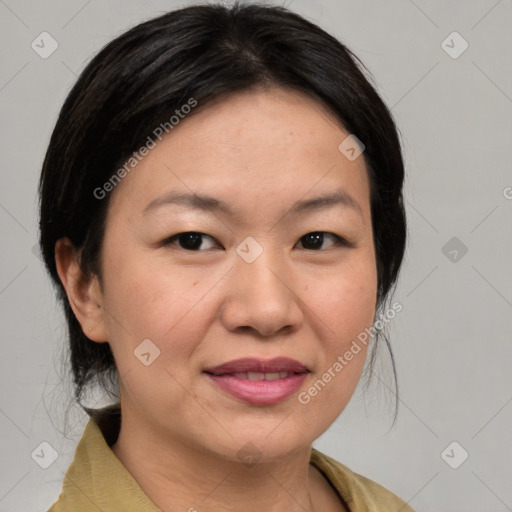 Joyful asian adult female with medium  brown hair and brown eyes