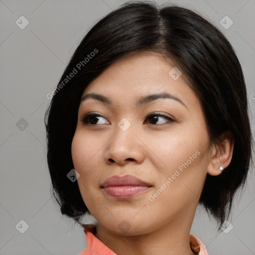 Joyful asian young-adult female with medium  black hair and brown eyes