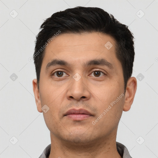 Neutral white young-adult male with short  black hair and brown eyes