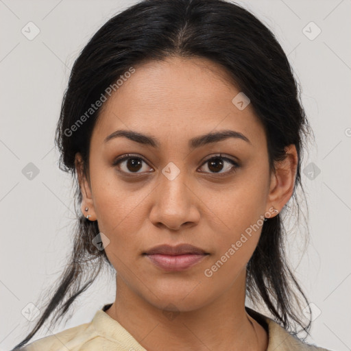 Joyful latino young-adult female with medium  brown hair and brown eyes