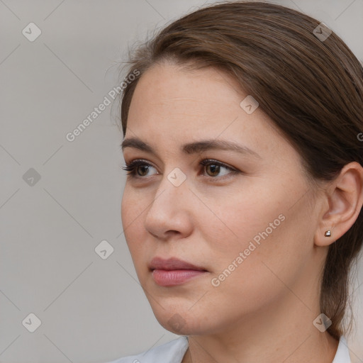 Neutral white young-adult female with medium  brown hair and brown eyes