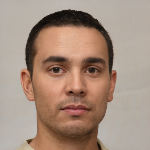 Neutral white young-adult male with short  black hair and brown eyes