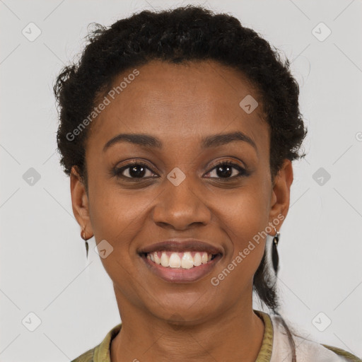 Joyful black young-adult female with short  brown hair and brown eyes