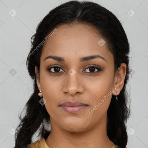 Joyful latino young-adult female with long  brown hair and brown eyes