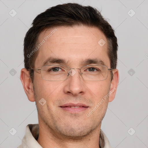 Joyful white adult male with short  brown hair and brown eyes