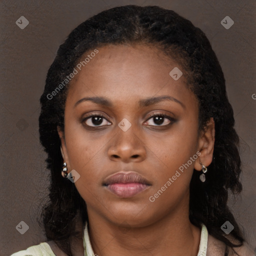 Neutral black young-adult female with long  brown hair and brown eyes