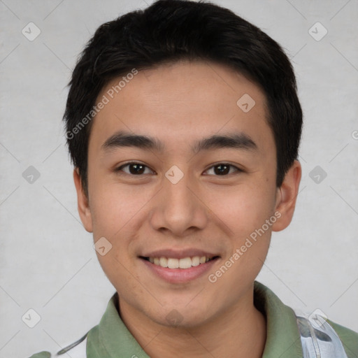 Joyful asian young-adult male with short  black hair and brown eyes