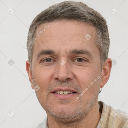 Joyful white adult male with short  brown hair and brown eyes