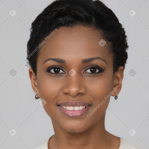 Joyful black young-adult female with short  black hair and brown eyes