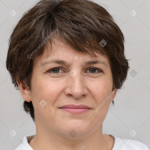 Joyful white adult female with short  brown hair and brown eyes