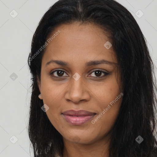 Joyful black young-adult female with long  brown hair and brown eyes