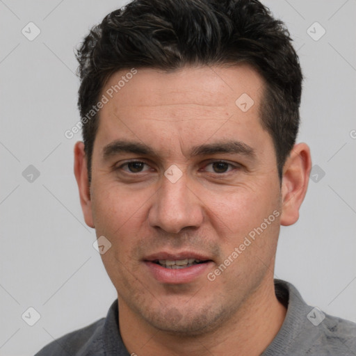 Joyful white adult male with short  black hair and brown eyes