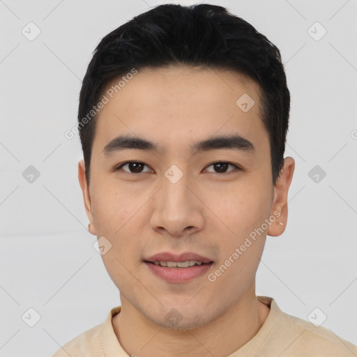 Joyful asian young-adult male with short  black hair and brown eyes