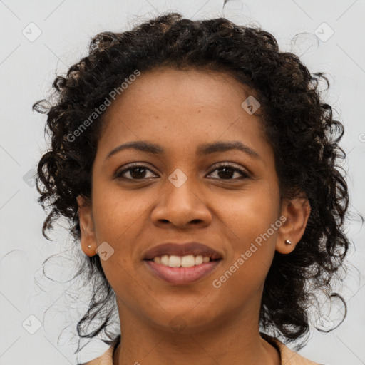 Joyful black young-adult female with long  brown hair and brown eyes