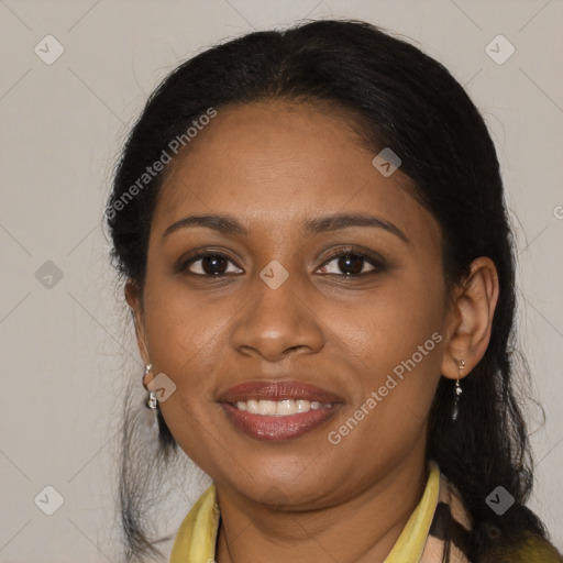 Joyful black adult female with medium  brown hair and brown eyes