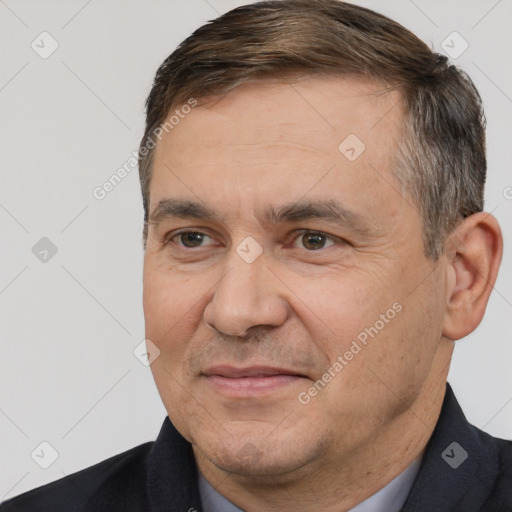 Joyful white adult male with short  brown hair and brown eyes