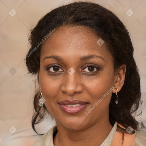 Joyful black adult female with medium  brown hair and brown eyes