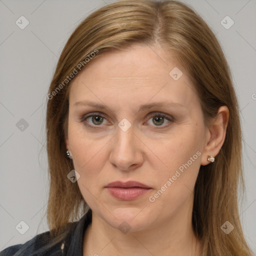 Joyful white adult female with medium  brown hair and grey eyes