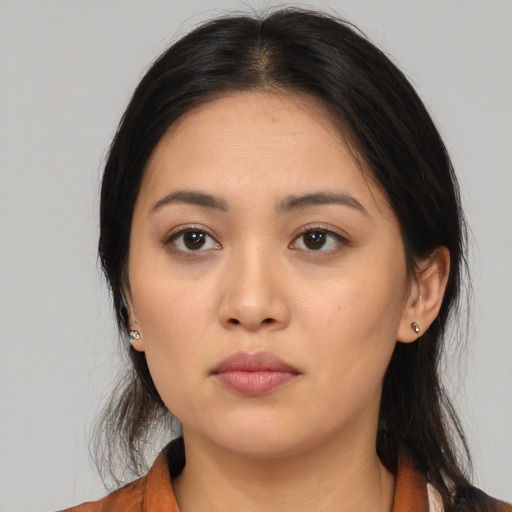 Neutral latino young-adult female with medium  black hair and brown eyes