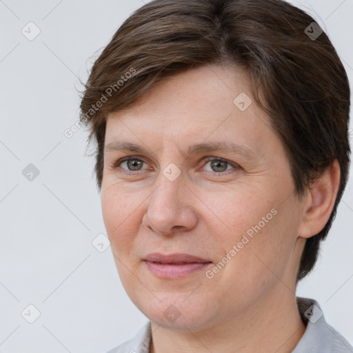 Joyful white adult female with short  brown hair and brown eyes