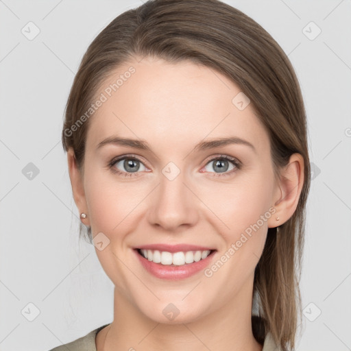 Joyful white young-adult female with medium  brown hair and grey eyes