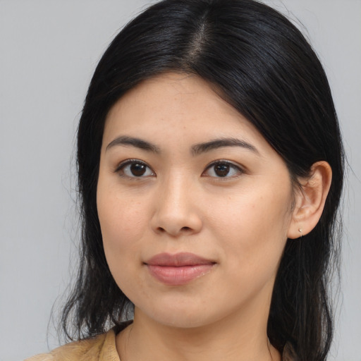 Joyful asian young-adult female with medium  black hair and brown eyes