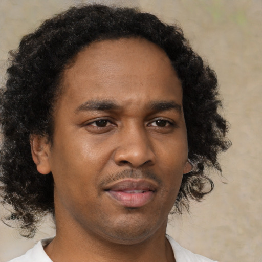 Neutral black young-adult male with short  brown hair and brown eyes