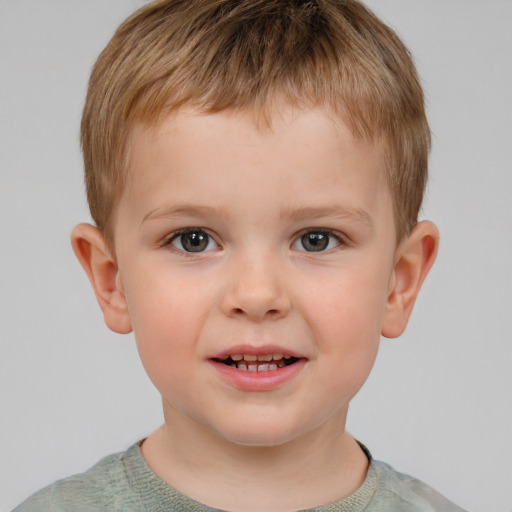 Joyful white child male with short  brown hair and grey eyes