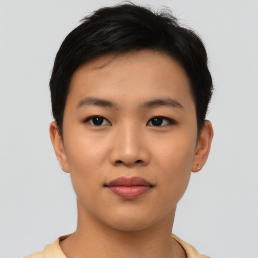 Joyful asian young-adult female with short  black hair and brown eyes