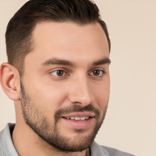 Joyful white young-adult male with short  brown hair and brown eyes