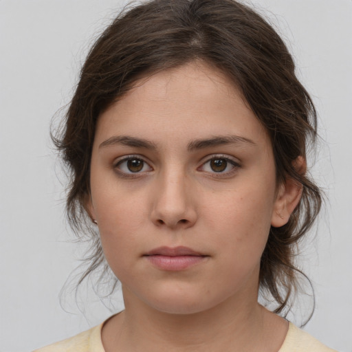 Neutral white young-adult female with medium  brown hair and brown eyes