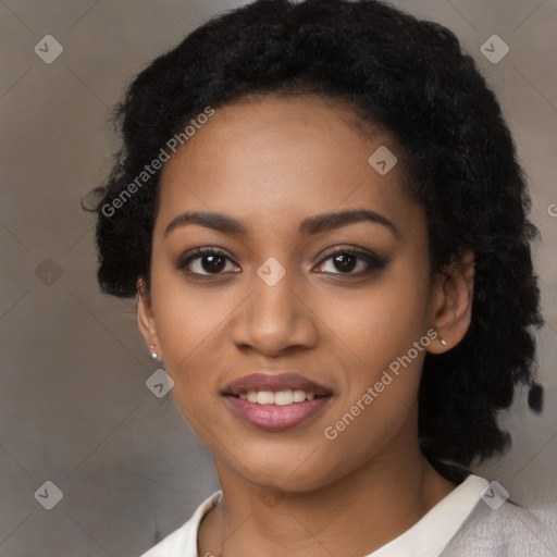 Joyful black young-adult female with long  black hair and brown eyes