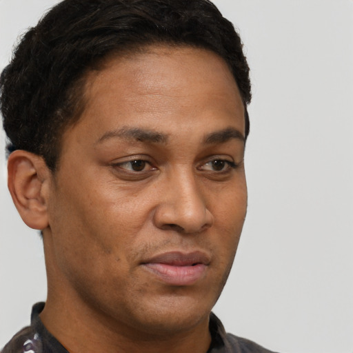 Neutral black adult male with short  brown hair and brown eyes