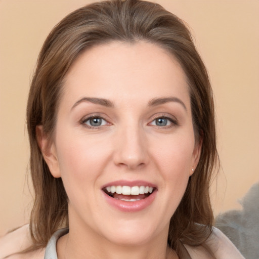 Joyful white young-adult female with medium  brown hair and grey eyes