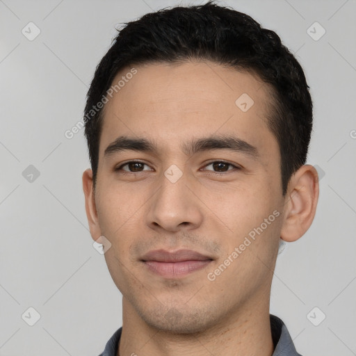 Joyful white young-adult male with short  black hair and brown eyes