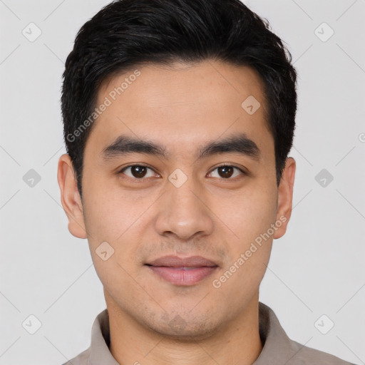 Joyful white young-adult male with short  black hair and brown eyes