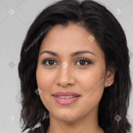 Joyful latino young-adult female with long  brown hair and brown eyes