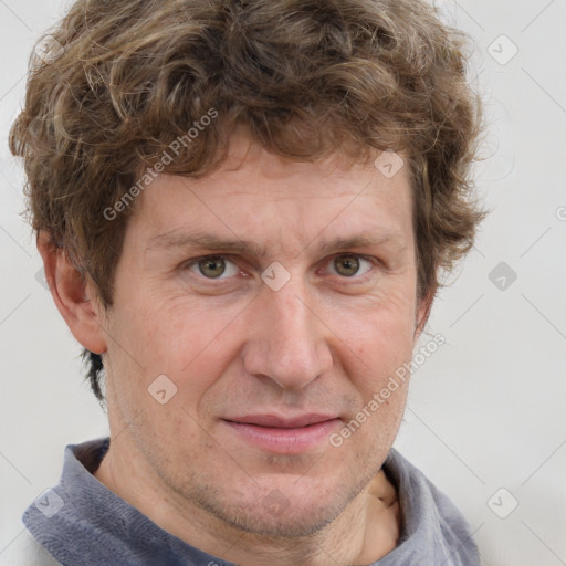 Joyful white adult male with short  brown hair and grey eyes