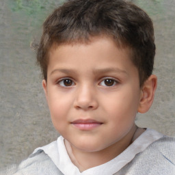 Joyful white child male with short  brown hair and brown eyes