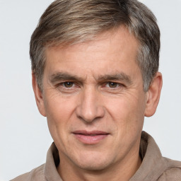 Joyful white middle-aged male with short  brown hair and brown eyes