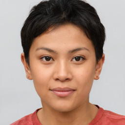 Joyful asian young-adult female with short  brown hair and brown eyes