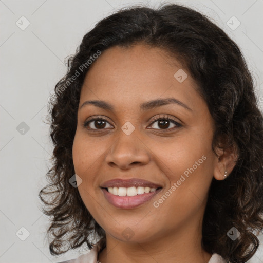 Joyful latino young-adult female with long  brown hair and brown eyes