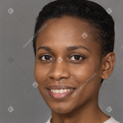 Joyful black young-adult female with short  brown hair and brown eyes